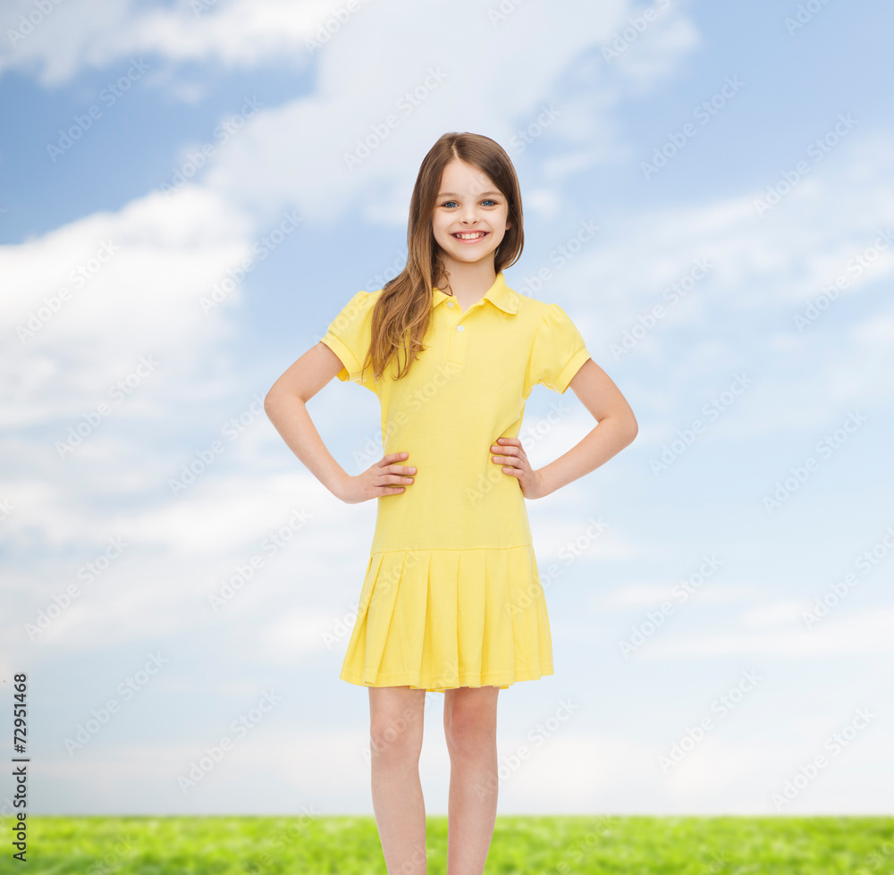 smiling little girl in yellow dress