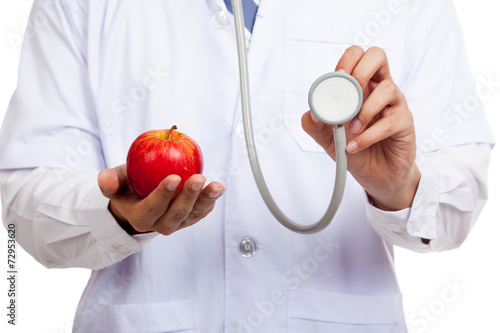 Asian male doctor with stethoscope and apple