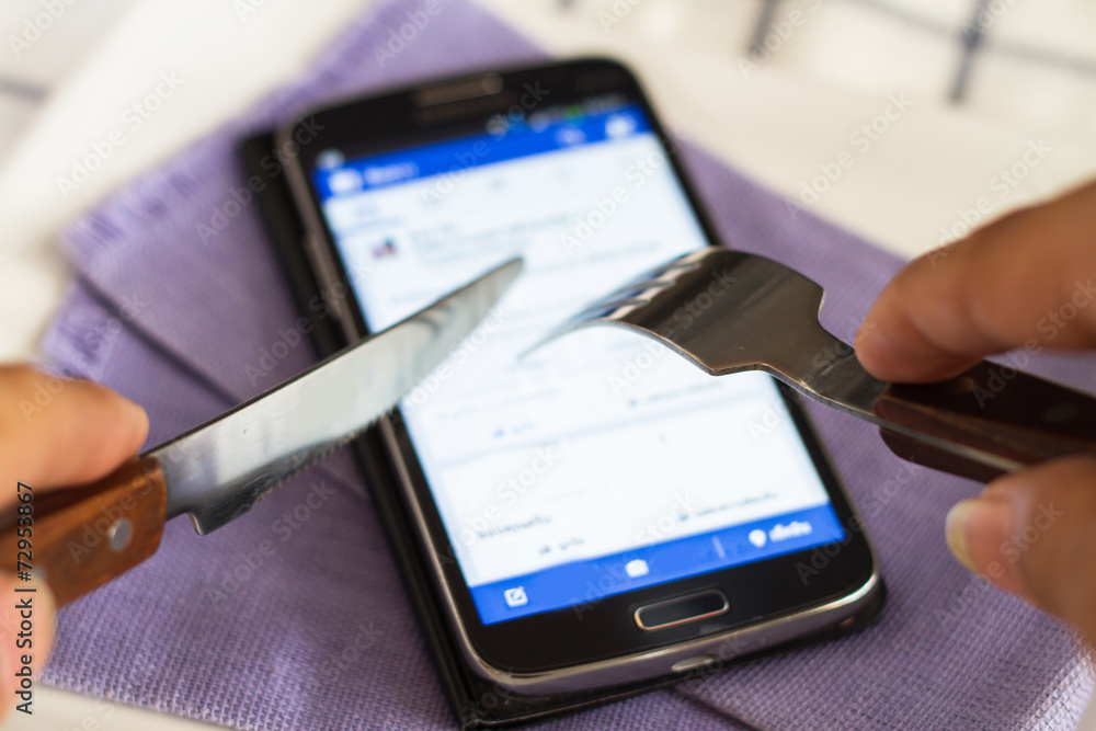 Smart phones, Mobile Knife and fork, eating on a plate. Smart phones, Mobile Knife and fork, eating on a plate.
