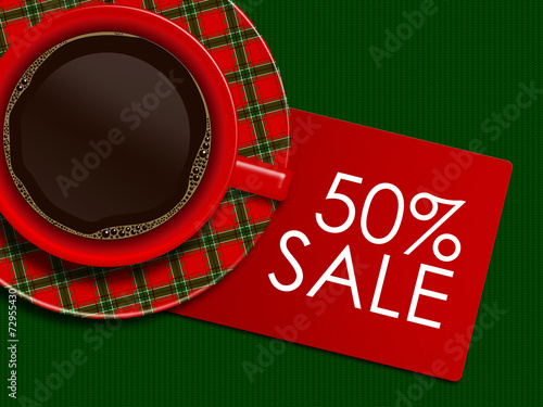 checkered christmas coffee with discount card lying on tableclot photo