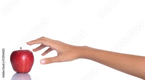 Girl hands reaching for a red apple over white background