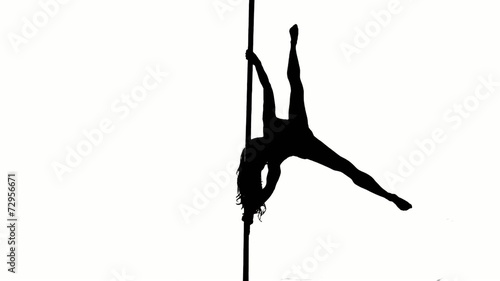 One caucasian woman pole dancer dancing in silhouette studio photo