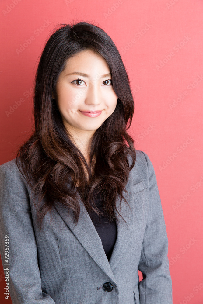 portrait of asian businesswoman on red background portrait of asian businesswoman on red background