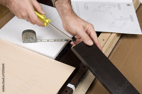 Wallpaper Mural Hands with Yellow Screwdriver Assembling Furniture Torontodigital.ca