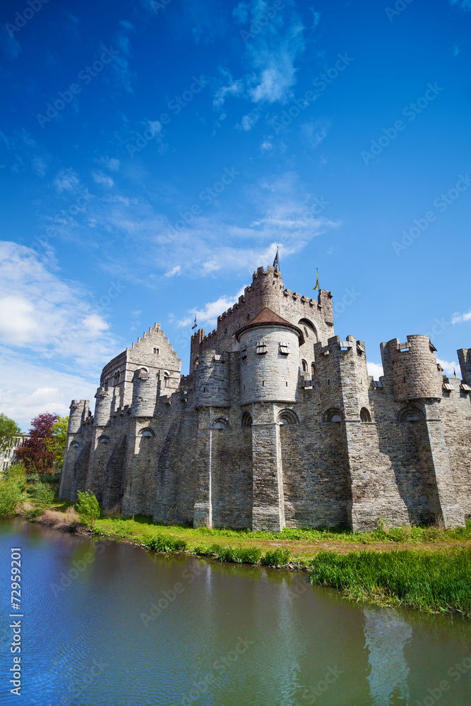 Gravensteen castle reflecting in river, Belgium