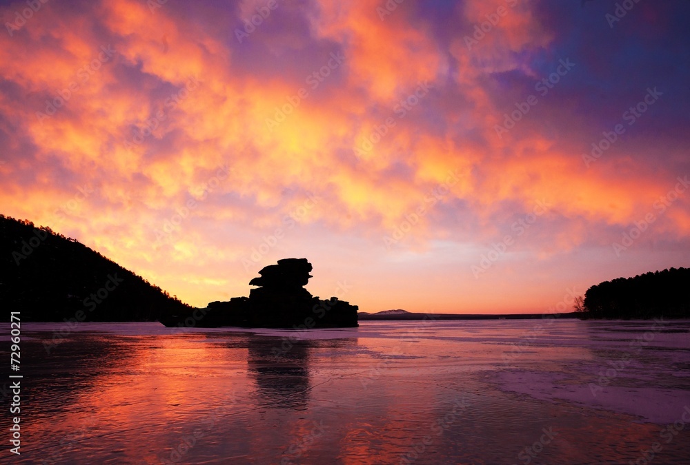 Magic sunrise on winter lake Borovoe. Kazakhstan.
