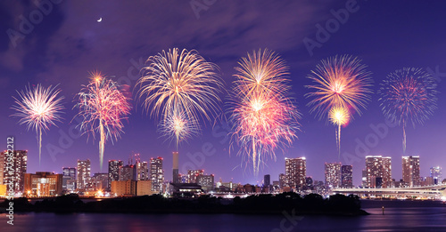 Fireworks celebrating over Tokyo cityscape at nigh © geargodz