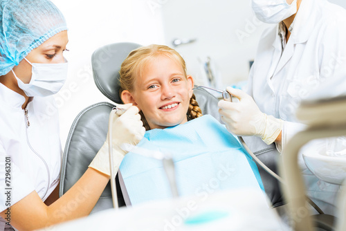 Dentist inspecting patient