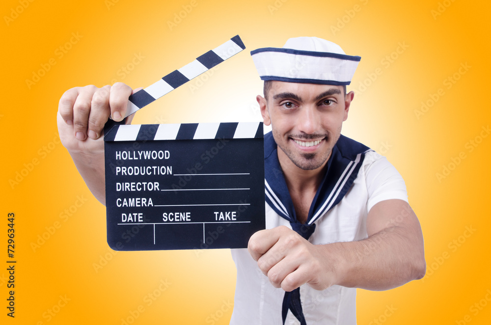 Sailor with movie clapper on white Sailor with movie clapper on white