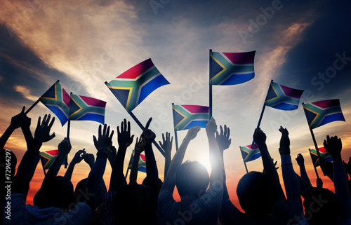 Quadro em tela People Waving South African Flags in Back Lit