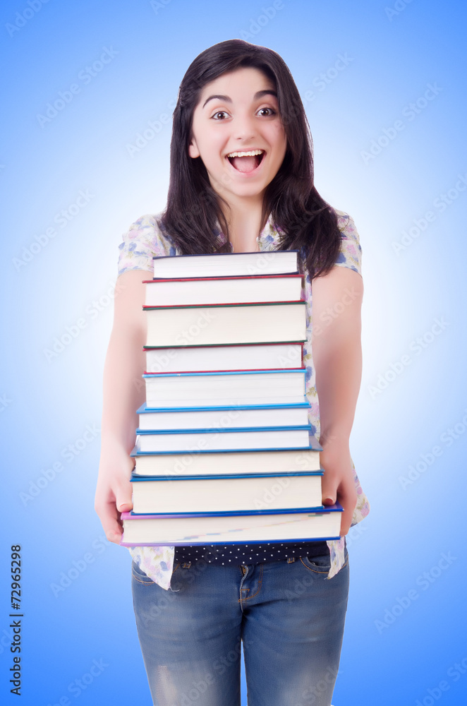 Young female student with books on white Young female student with books on white