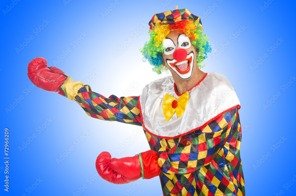 Clown with boxing gloves isolated on white Clown with boxing gloves isolated on white