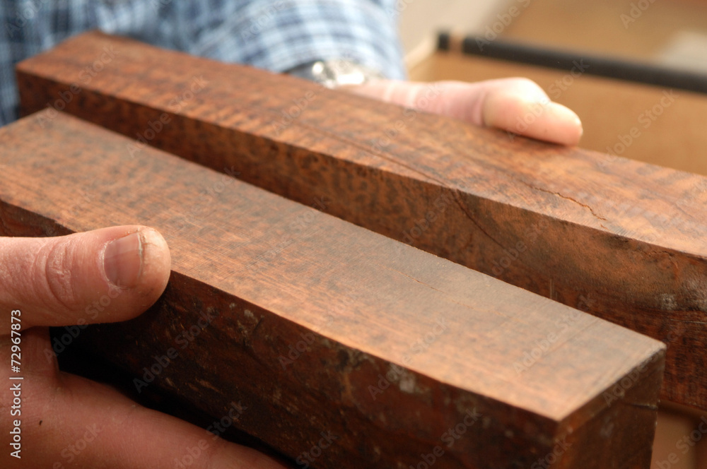 Hands with square blocks of wood Hands with square blocks of wood