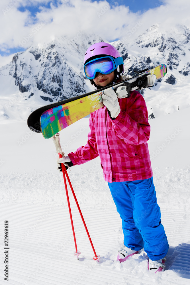 Ski, winter fun - lovely girl enjoying ski vacation