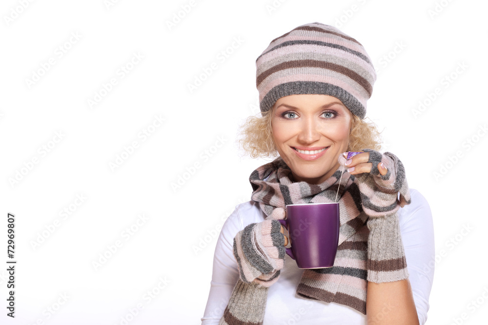 Woman in winter clothes drinking tea Woman in winter clothes drinking tea