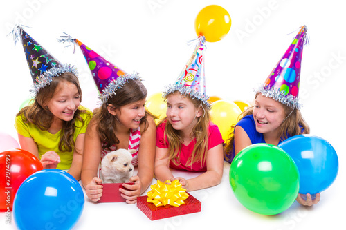 Happy kid girls puppy dog gift in birthday party