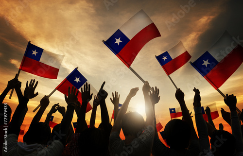 Obraz na plátně Silhouettes of People Holding Flag of Chile