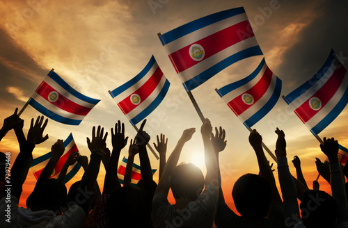 Картината върху платно Silhouettes of People Holding Flag of Costa Rica