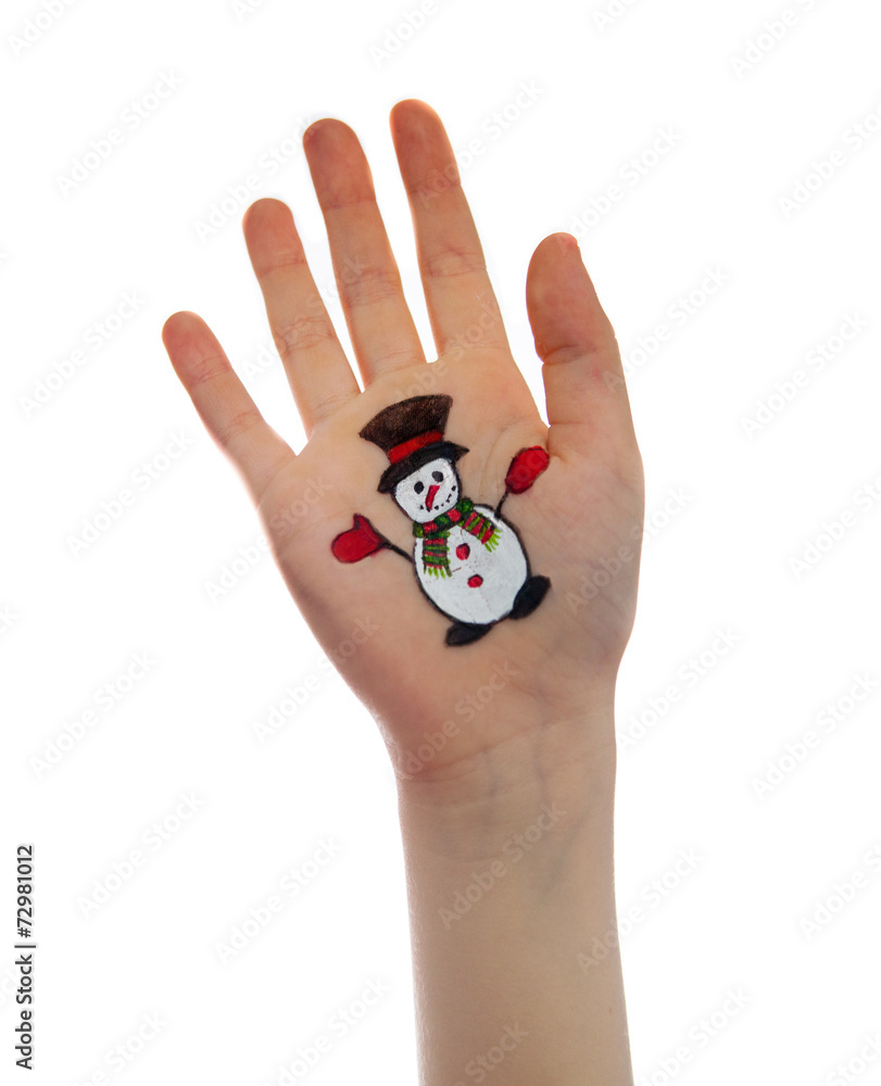 Snowman painted on child's hand. Christmas concept Snowman painted on child's hand. Christmas concept