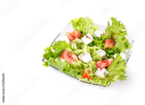 Above view of a salad with tomato and cheese