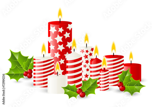 Christmas candles with holly berries