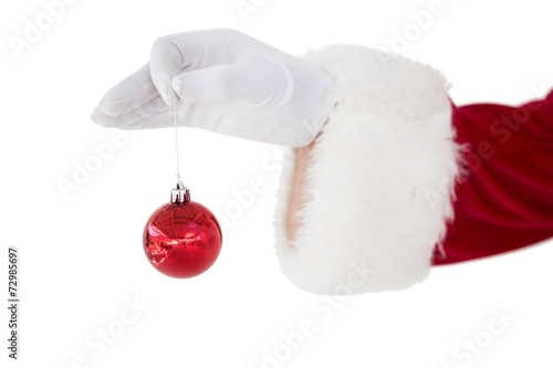 Santa claus holding red bauble