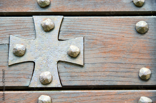 cross lombardy   seprio abstract     a  door curch  closed wood photo