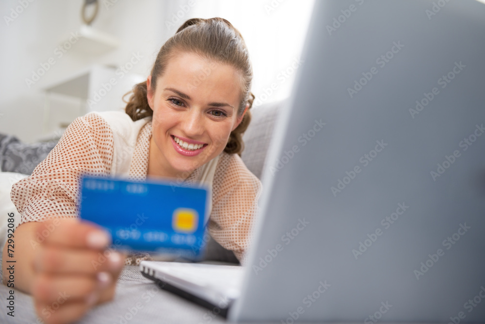 Happy young woman making online shopping Happy young woman making online shopping