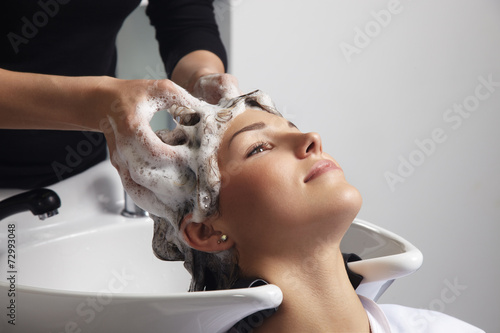 woman getting hair wash in salon