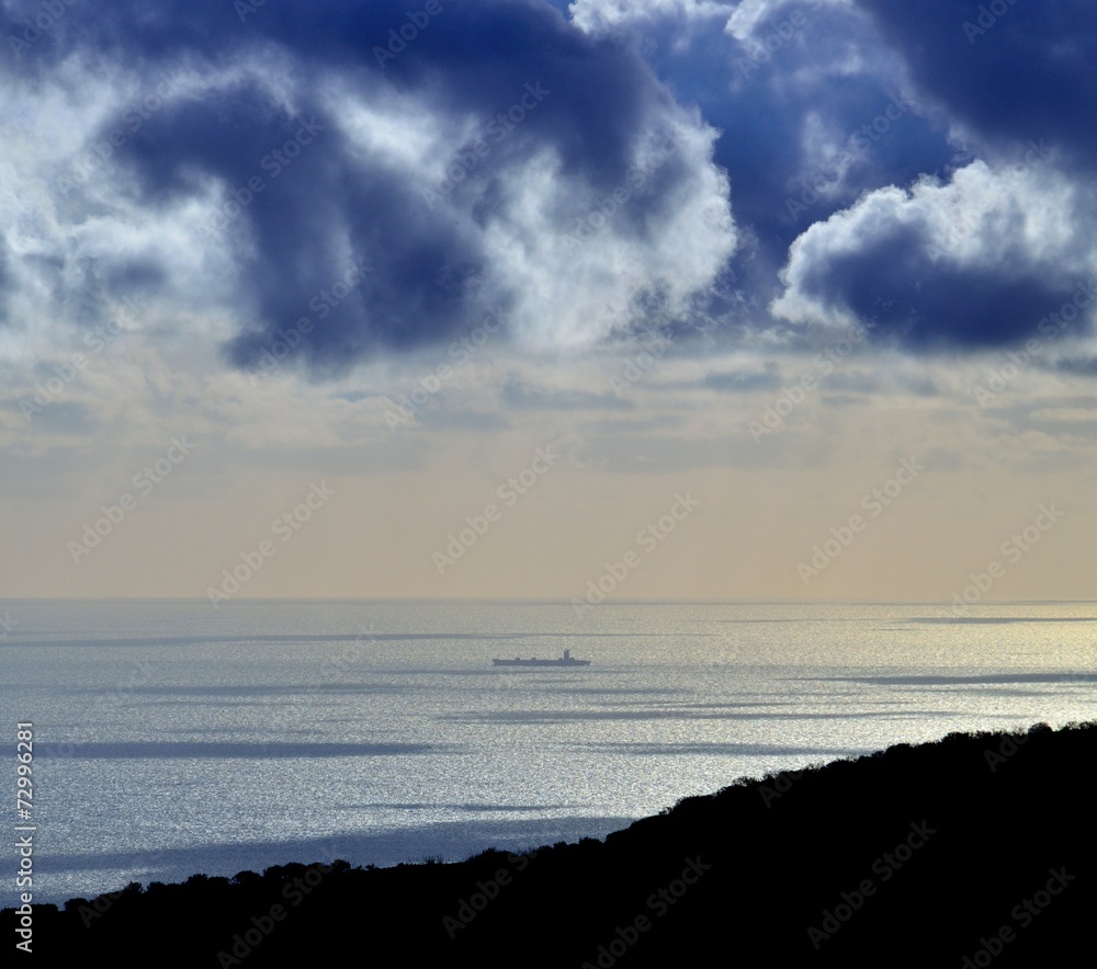 Colored panoramic with clouds and ship on the sea