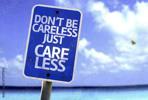 Don't Be Careless Just Care Less sign with a beach