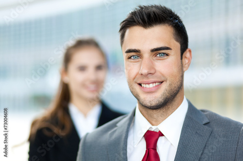 Smiling business couple outdoor © Minerva Studio