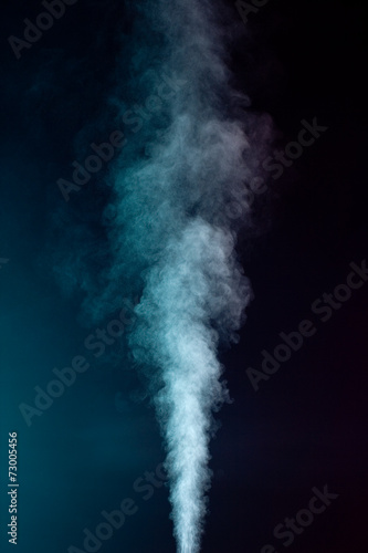 Blue vapor on the black background