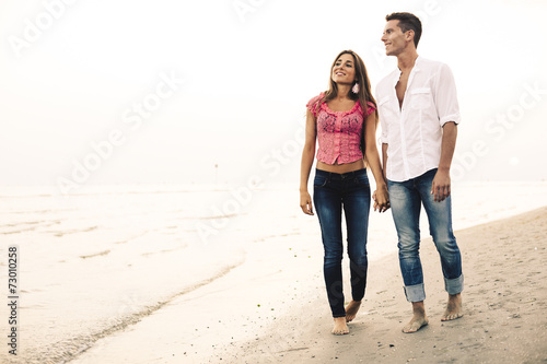 Couple on the beach at Sunset