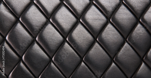 Black quilted leather background