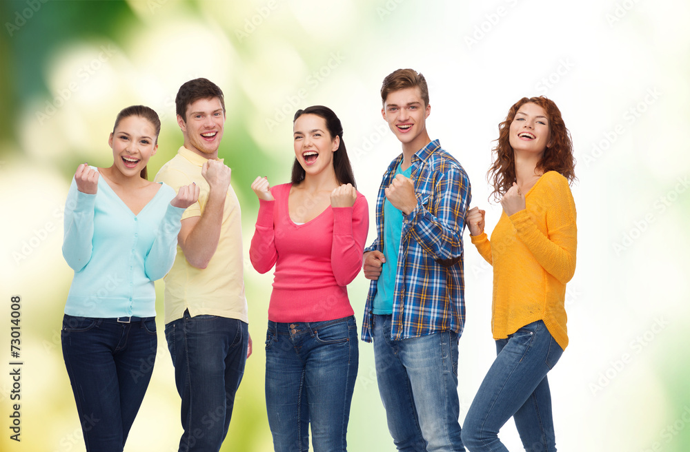 group of smiling teenagers over green background group of smiling teenagers over green background