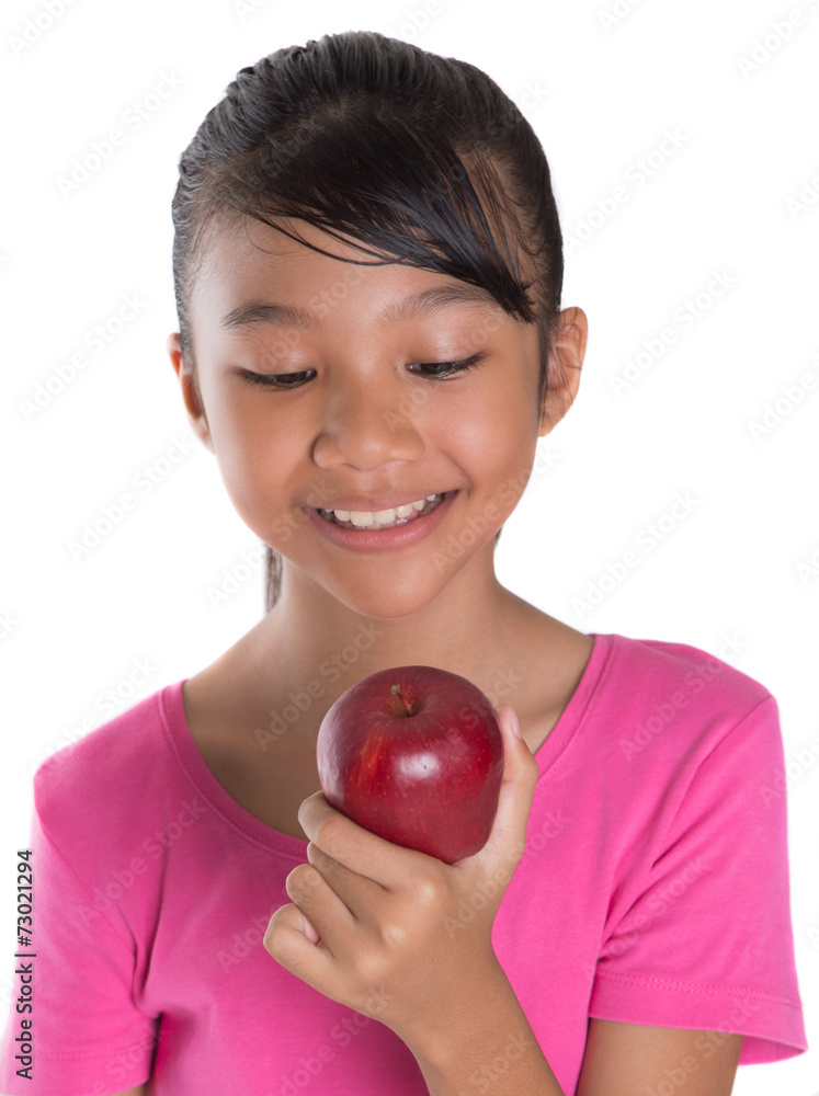 Young Asian Malay teenager with a red apple Young Asian Malay teenager with a red apple