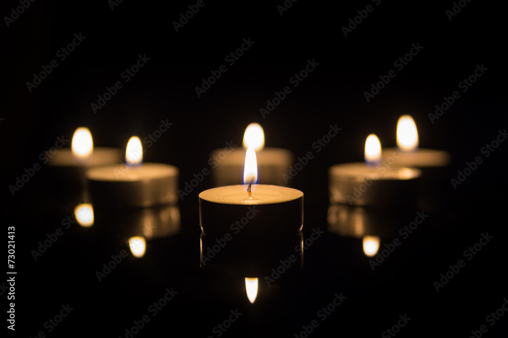 Tea Candles with Reflection on Black Tea Candles with Reflection on Black