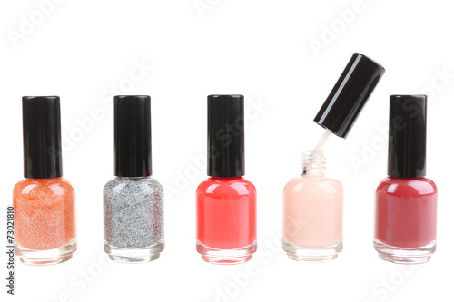 Colorful nail polishes isolated on white