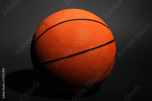 Basketball ball on black background © Africa Studio