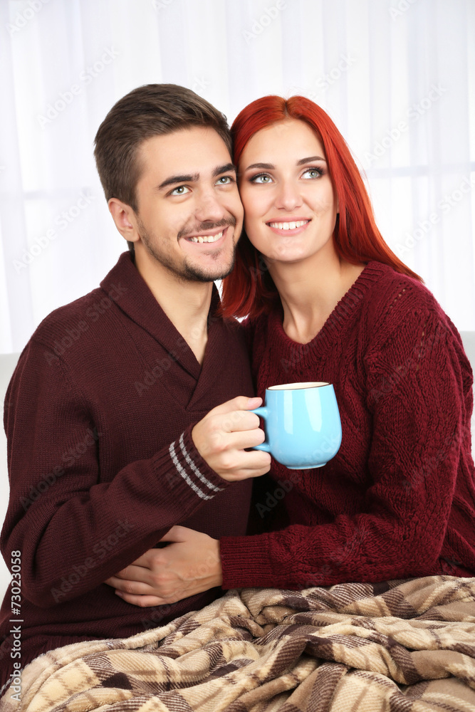 Loving couple with hot drink