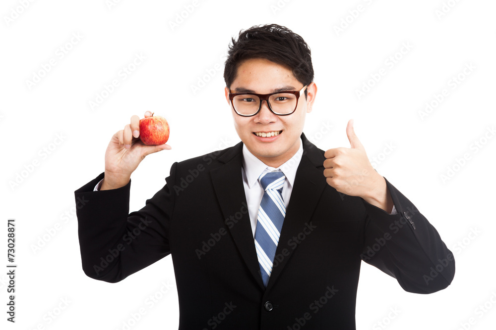 Healthy Asian businessman thumbs up with red apple Healthy Asian businessman thumbs up with red apple