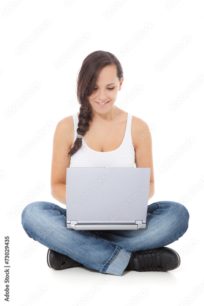 Naklejka premium Attractive girl using laptop. All on white background.