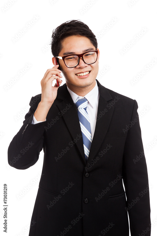 Asian businessman smile talk on mobile phone Asian businessman smile talk on mobile phone