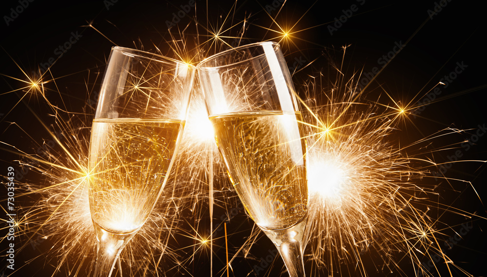 Glasses of champagne with sparklers - obrazy, fototapety, plakaty 