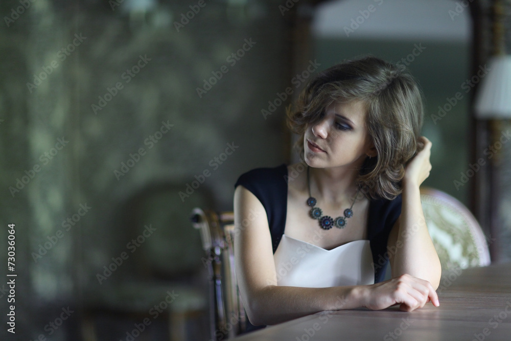 portrait of a beautiful sad girl in a blue dress portrait of a beautiful sad girl in a blue dress