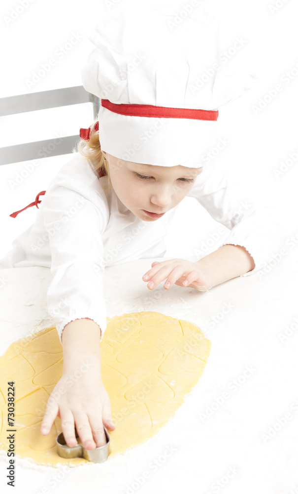 little girl cutting cookies little girl cutting cookies