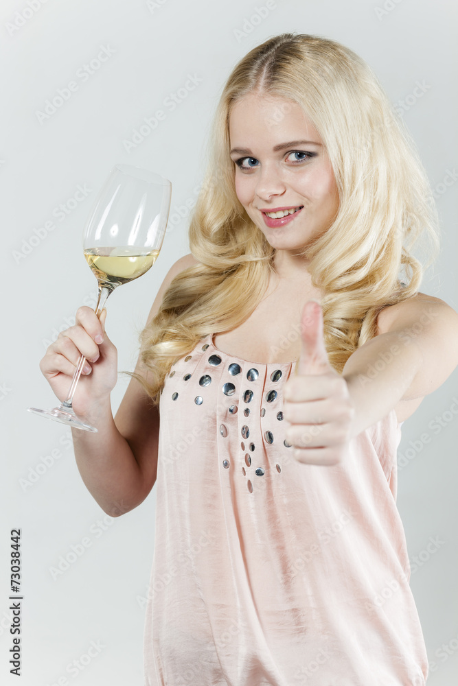 portrait of young woman with a glass of white wine