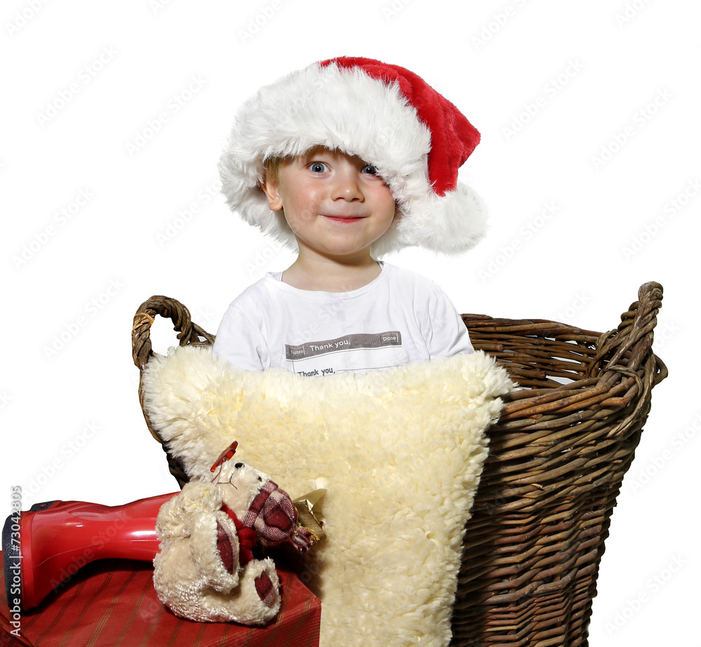 Obraz premium Junge im weihnachtskorb