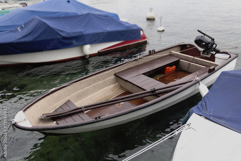 Rowing boat on the water at the pier